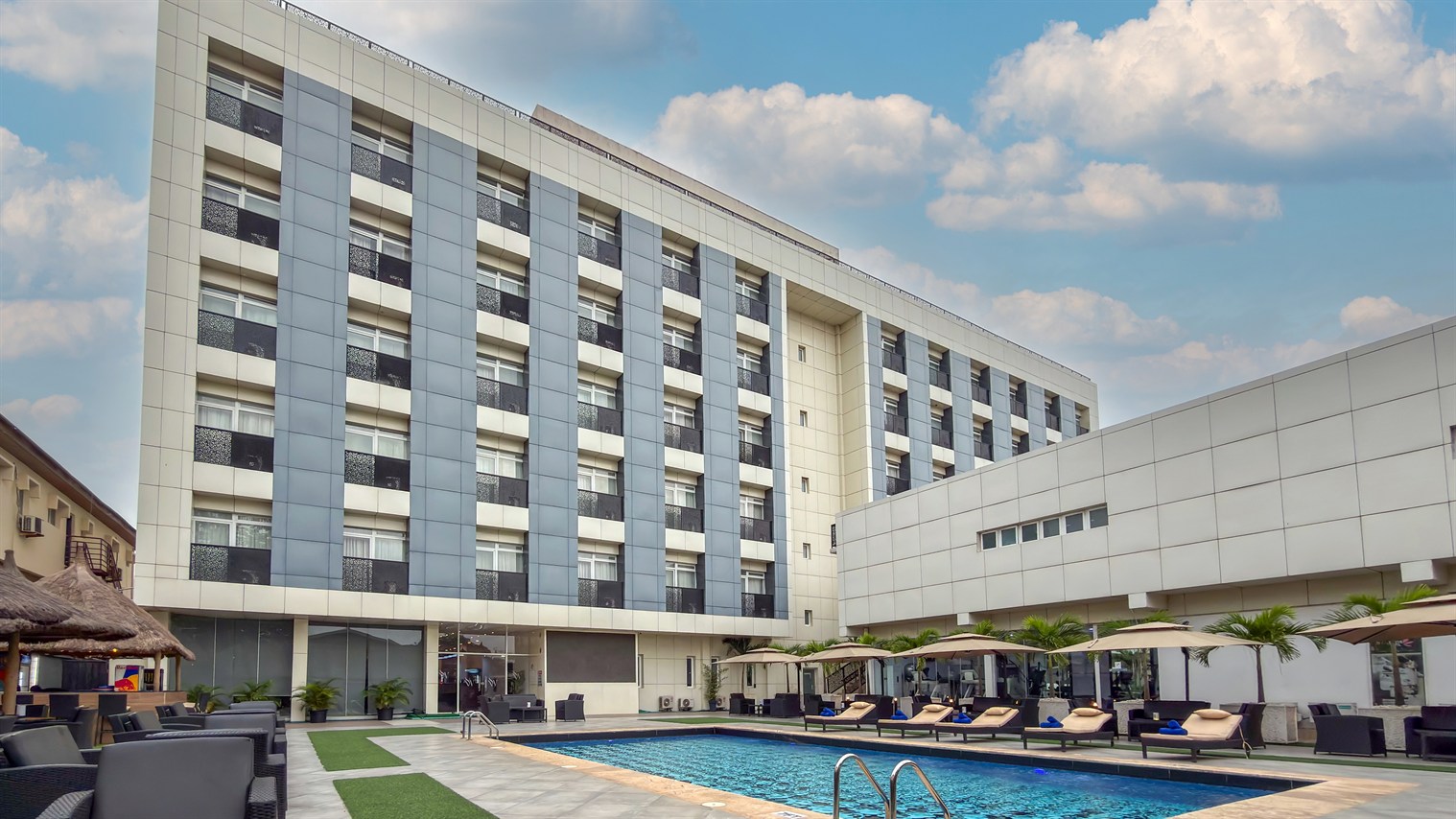 The residence and its swimming pool under a blue sky